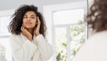 Woman looking at skin