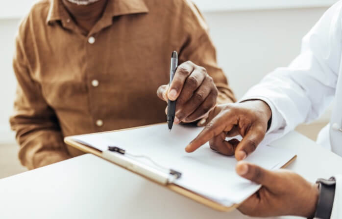 Man filling out patient forms