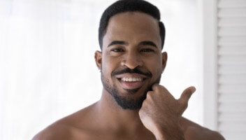 man smiling with healthy hands