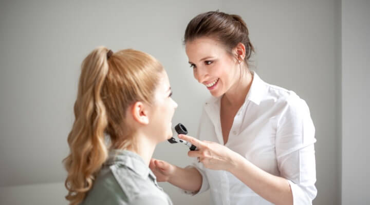 Woman examining skin